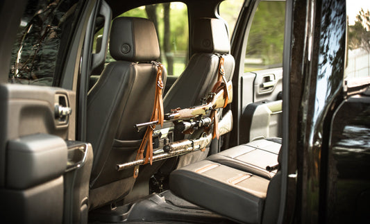 South Texas Slings gun rack mounted on the back of a truck front seat